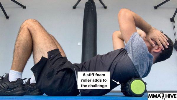 A stiff foam roller gives an extra challenge on the thoracic stretch