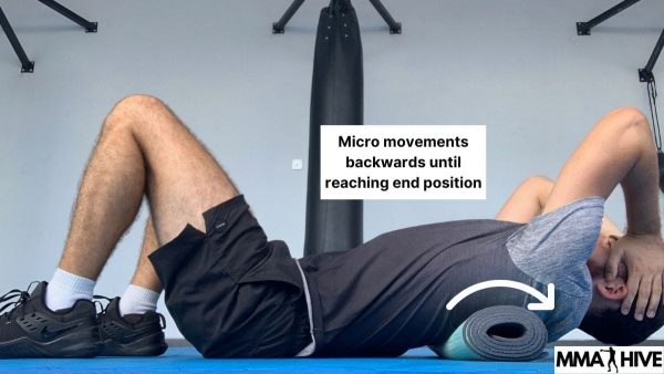 Make micro movements to rotate the thoracic spine backwards whilst breathing deeply