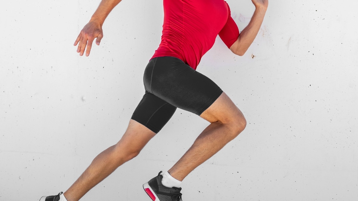 Man running wearing compression shorts