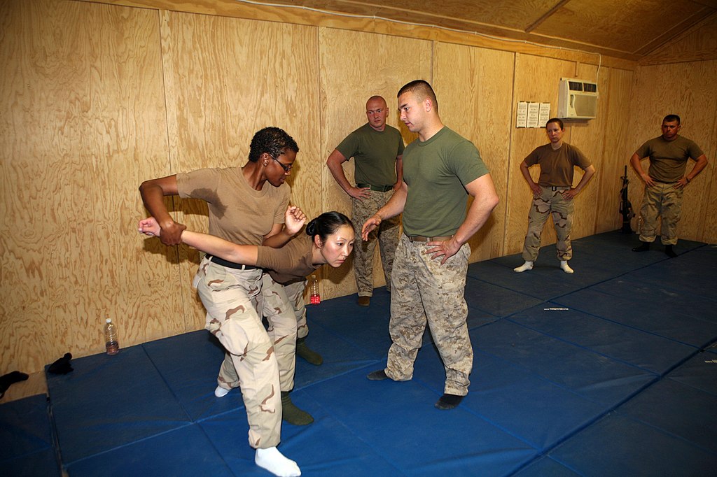 Female Marine Corps practicing Krav Maga techniques