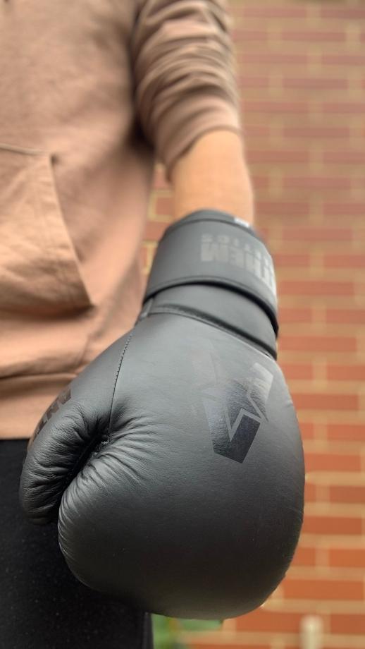 Wearing Anthem Athletics Stormbringer II Boxing Gloves Stealth Gunmetal by the waist side