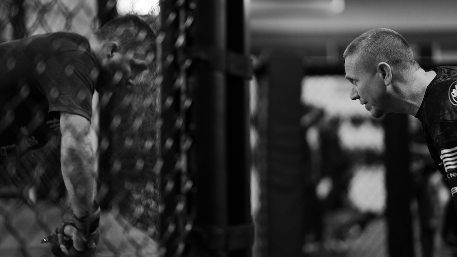 Trevor Wittman talking to Justin Gaethje in the cage at his gym