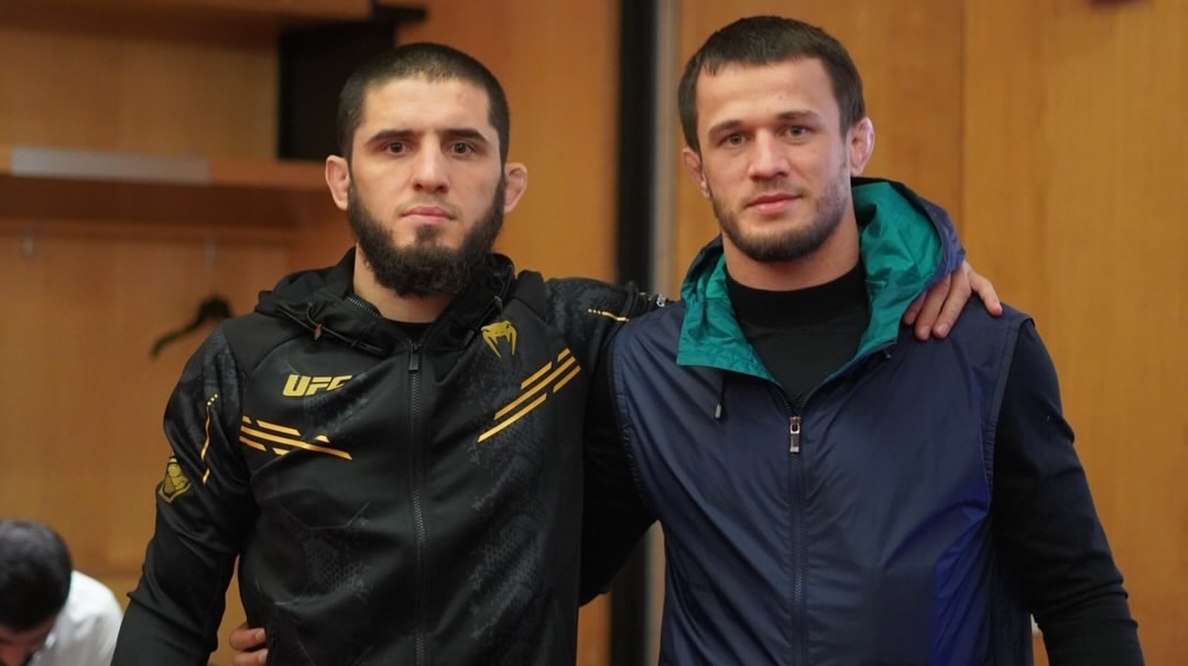 usman nurmagomedov and islam makhachev posing for photo in locker room