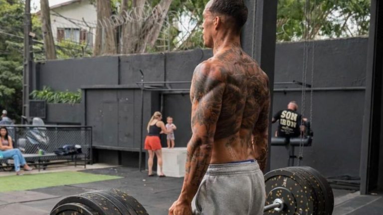 charles oliveira looking lean lifting weights