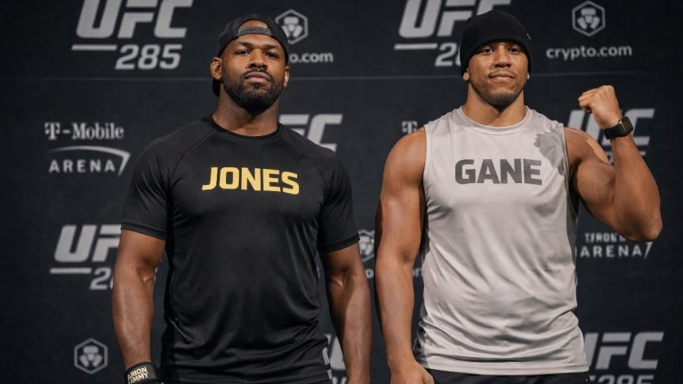 jon jones and ciryl gane posing at UFC weigh ins