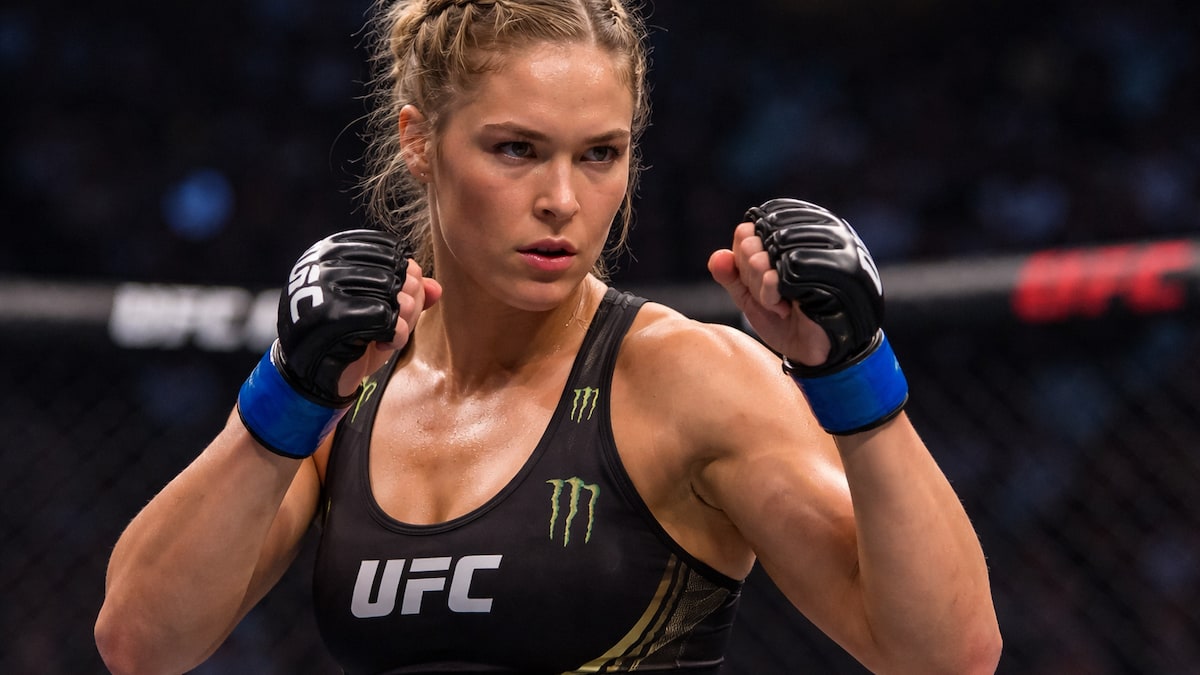 ronda rousey posing in a fight stance inside the ufc octagon