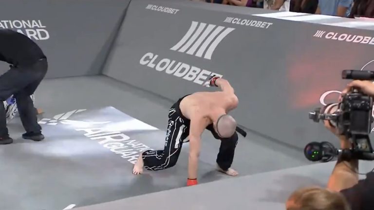 winged c posing in victory at karate combat arena