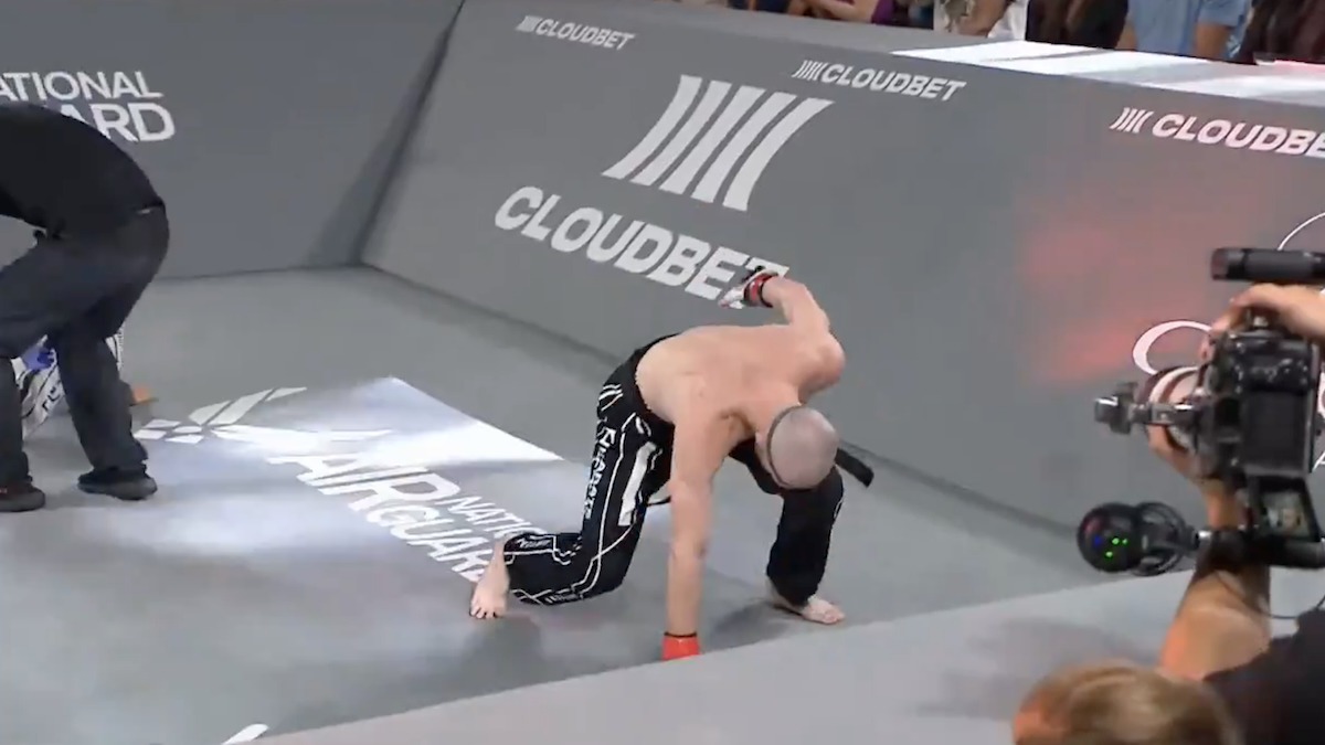 winged c posing in victory at karate combat arena